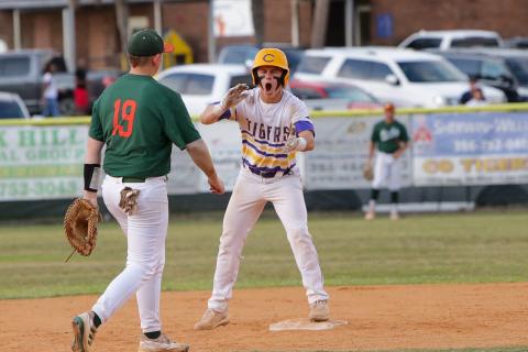 Columbia’s Truitt Todd celebrates on second base after hitting a two-RBI double against Mosley in the Region 1-5A semifinals on Thursday night. (BRENT KUYKENDALL/Lake City Reporter)