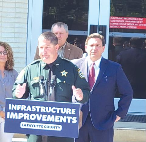 Lafayette County Sheriff Brian Lamb (left) speaks in front of Gov. Ron DeSantis on Wednesday. (COURTESY)