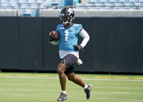 Jacksonville Jaguars running back Travis Etienne practices a punt return drill during practice on Monday in Jacksonville. (JOHN RAOUX/Associated Press)