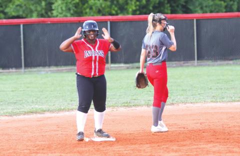 Fort White’s N’Coreyia Atkins celebrates after an RBI double against Lafayette during the Region 3-1A semifinals on Thursday night. (MORGAN MCMULLEN/Lake City Reporter)