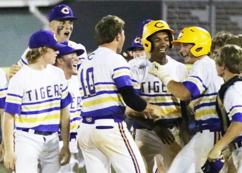 Columbia first baseman Ty Floyd (right) celebrates with teammates after hitting a walk-off single against Riverview in the District 3-5A semifinals on Tuesday. (JORDAN KROEGER/Lake City Reporter)