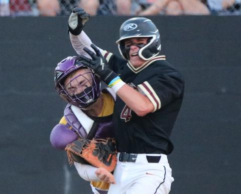 Columbia catcher Hayden Gustavson tags out St. Augustine’s Merrick Beamish during Thursday’s District 3-5A championship game. Beamish was ejected for throwing an elbow Toward Gustavson’s face. (JORDAN KROEGER/Lake City Reporter)
