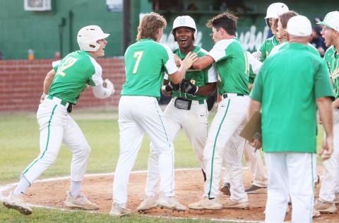 Suwannee’s Malachi Graham celebrates with his team at home plate after hitting a home run against Wakulla during the District 2-4A championship on Thursday. (PAUL BUCHANAN/Special to the Reporter)