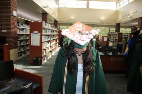 Florida Gateway College graduate Natalia Duarte shows off the decoration on her cap ahead of Friday’s commencement ceremony. (TONY BRITT/Lake City Reporter)