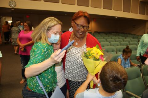 Westside Elementary school kindergarten teacher Argie Crusaw is congratulated after being honored as one of the Columbia County School District’s inaugural ‘Teacher of a Lifetime’ award winners Tuesday night. (TONY BRITT/Lake City Reporter)