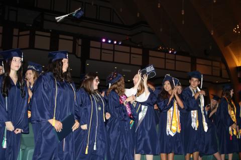 Belmont Academy Class of 2022 students react after turning their tassels and becoming graduates Friday night at Christian Fellowship Church. (TONY BRITT/Lake City Reporter)