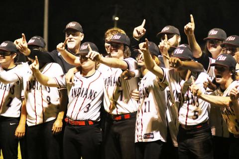 Fort White’s baseball team celebrates after defeating Lafayette 3-2 to win the Region 3-1A title on Friday night. (MORGAN MCMULLEN/Lake City Reporter)