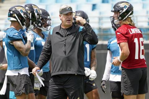 Jacksonville Jaguars head coach Doug Pederson (center) directs practice on Monday in Jacksonville. At right is quarterback Trevor Lawrence. (JOHN RAOUX/Associated Press)
