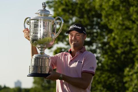Justin Thomas holds the Wanamaker Trophy after winning the PGA Championship in a playoff against Will Zalatoris at Southern Hills Country Club on Sunday in Tulsa, Okla. (ERIC GAY/Associated Press)