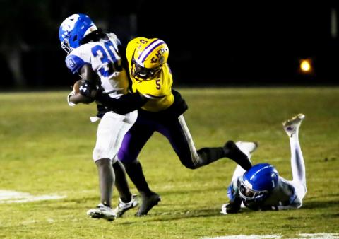 Columbia's Jaden Robinson makes a tackle against Riverside last season. (BRENT KUYKENDALL/Lake City Reporter)