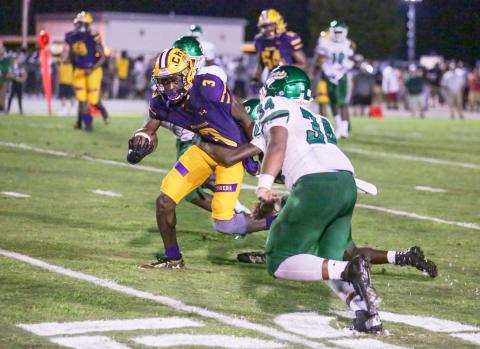 Columbia receiver TJ Jones tries to escape a tackle against Suwannee on Aug. 31, 2018. (BRENT KUYKENDALL/Lake City Reporter)