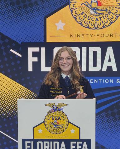 Anelise Bullard holds the gavel after being elected as the Florida FFA State President. (COURTESY)