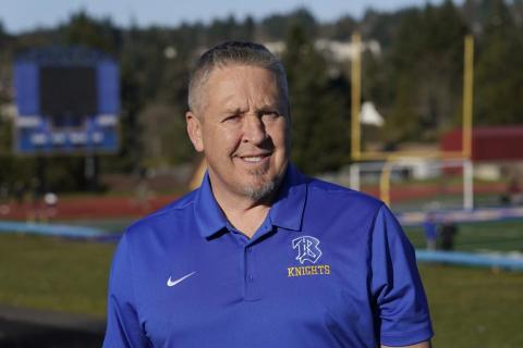 Joe Kennedy, a former assistant football coach at Bremerton High School in Bremerton, Wash., poses for a photo March 9, 2022, at the school's football field. (TED S. WARREN/AP File)