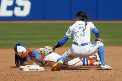 Florida outfielder Cheyenne Lindsey slides in safe at second base before UCLA infielder Briana Perez can make the tag during the fifth inning of Sunday’s Women's College World Series game in Oklahoma City. (AP Photo/Alonzo Adams)