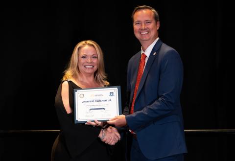 Citrus County Clerk Angela Vick presents Clerk Jay Swisher with his certification as a Florida Clerk and Comptroller. (COURTESY)