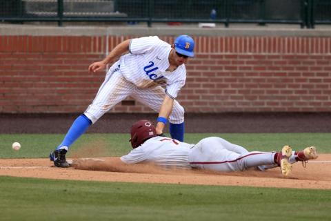 UCLA infielder Kyle Karros mishandles the ball as Florida State's Jaime Ferrer slides safely into third base on Friday in Auburn, Ala. (BUTCH DILL/Associated Press)