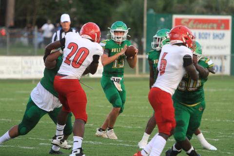 Suwannee quarterback Bronsen Tillotson drops back to pass against Hamilton County in the Preseason Classic on Aug. 20, 2021. The teams will face each other in the regular season this year on Sept. 2 in Jasper. (FILE)