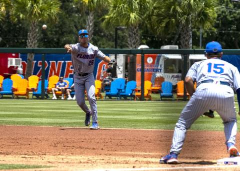 Florida's Sterlin Thompson throws to first base for an out against Central Michigan during Sunday's NCAA regional game in Gainesville. (CYNDI CHAMBERS/Ocala Star-Banner via AP)