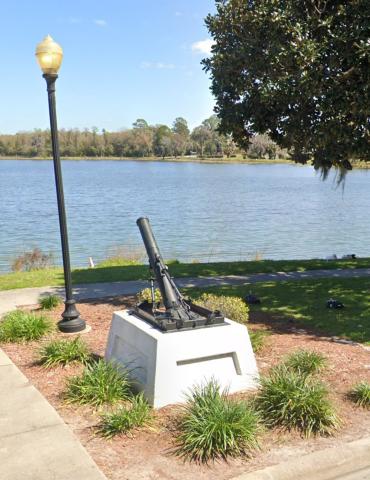 A World War I trench mortar sits on the banks of Lake DeSoto as a memorial to all who fought in the war. (COURTESY)