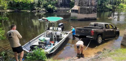 Members of the Columbia County Sheriff’s Office dive team pull a stolen pickup out of the Santa Fe River near the U.S. Highway 27 boat ramp on Monday. (PHOTOS COURTESY COLUMBIA COUNTY SHERIFF’S OFFICE)