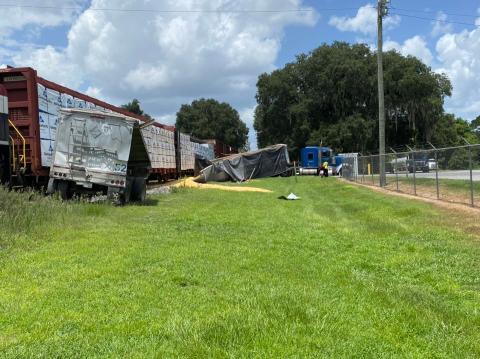 A train hit a trailer full of corn near the Pilgrim’s Pride Feed Mill in Live Oak on Friday, spilling the load onto the ground and railroad tracks. (COURTESY SUWANNEE COUNTY FIRE RESCUE)