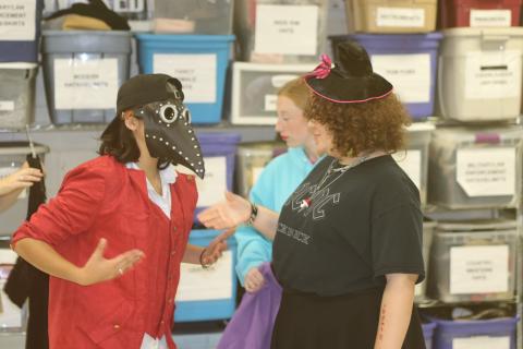 Students attending the Columbia High School Theater Camp try on various costumes Wednesday morning. Approximately 50 students have been attending the week-long camp, which culminates with a production on Friday afternoon. (TONY BRITT/Lake City Reporter)