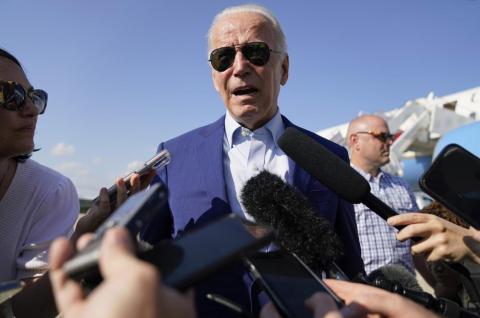 President Joe Biden speaks to members of the media after exiting Air Force One on July 20 at Andrews Air Force Base, Md. (AP FILE)