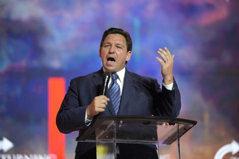 Florida Gov. Ron DeSantis addresses attendees during the Turning Point USA Student Action Summit on Friday in Tampa. (PHELAN M. EBENHACK/Associated Press)