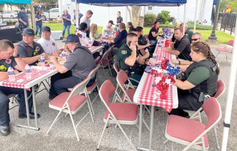 First responders from the Lake City Fire Department, Lake City Police Department and Columbia County Sheriff’s Office enjoyed the luncheon last July. (FILE)