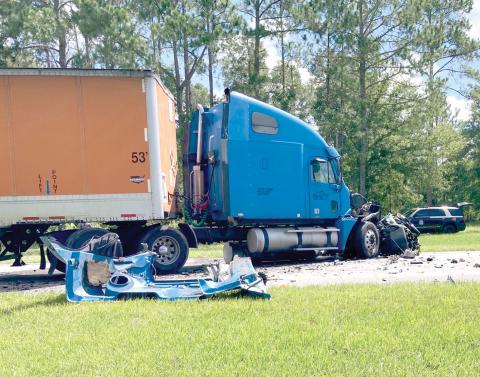 A speeding car ran head-first into a tractor trailer just north of High Springs on Wednesday morning. The car’s driver was killed. (COURTESY/FLORIDA HIGHWAY PATROL)