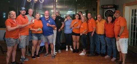 Members of the Elks Lodge pose with CCSO Deputy Shane Hartopp (black shirt) during the Lodge’s barbecue dinner fundraiser. Local residents also donated cakes to be auctioned off, with the proceeds benefiting Hartopp’s recovery from a flash bang grenade injury. (COURTESY)