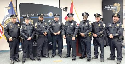 Lake City Police Chief Gerald Butler (left) promoted five officers in a ceremony Tuesday. Those promoted include (from left) Cpl. Gary Borchardt, Sgt. Michael Del Castillo, Cpl. Tim Parisi, Cpl. Brandon Rose and Cpl. LaQuinta Lovick-Plemmons. Also pictured are Assistant Chief Andy Miles (Second from right) and Lt. Garrett Register (right). (COURTESY)