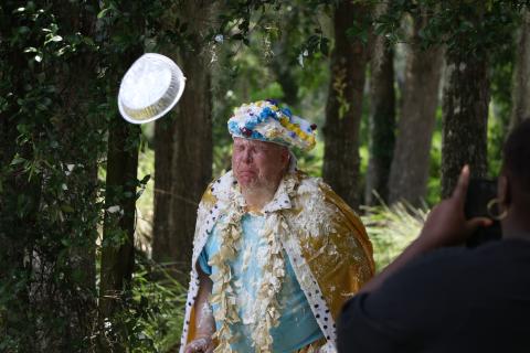 Lifestyle Enrichment Center Executive Director David Huckabee braces for impact as a whipped cream pie flies at him during Columbia County Senior Services’ 50th anniversary celebration on Thursday. (MORGAN MCMULLEN/Lake City Reporter)