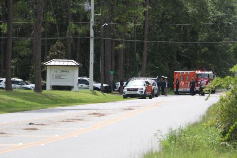 First responders congregate on the Florida Gateway College campus Wednesday afternoon after a bomb threat was called in against the school. (MORGAN MCMULLEN/Lake City Reporter)