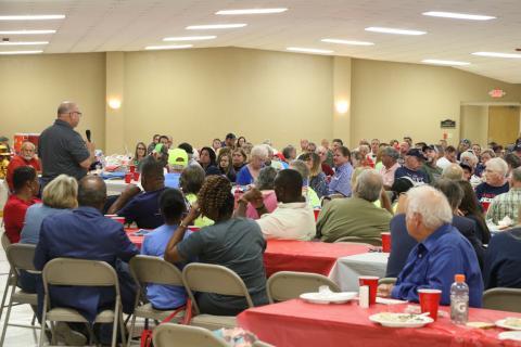 County Commissioner Rocky Ford speaks to the hundreds that attended Thursday’s Columbia County Republican Party rally at the Florida Gateway Fairgrounds banquet hall. (MORGAN MCMULLEN/Lake City Reporter)