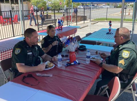 Members of the Columbia County Sheriff’s Office talk while enjoying a free lunch Friday at the First Responder Appreciation Luncheon at GulfCoast Financial Services. (TODD WILSON/Lake City Reporter)