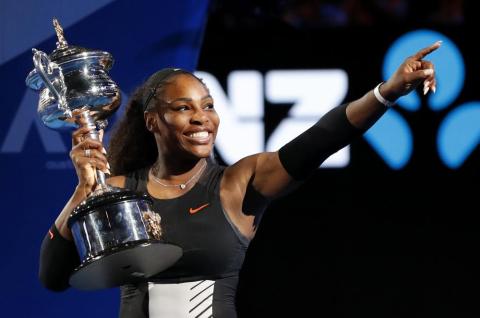 Serena Williams holds her trophy after defeating her sister Venus during the women's singles final at the Australian Open on Jan. 28, 2017, in Melbourne, Australia. (AP FILE)
