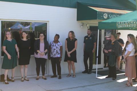 Lisa Burnham (far left) address the crowd during the Saint Leo University Lake City Education Center 25th Anniversary Celebration on Thursday afternoon. (TONY BRITT/Lake City Reporter)