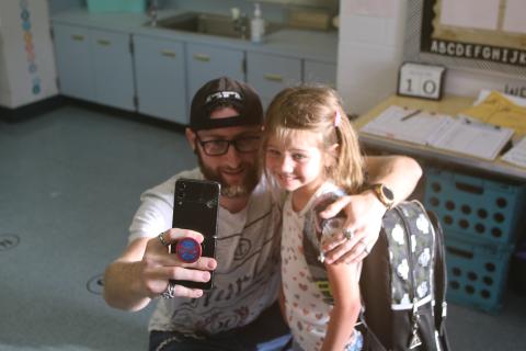 Vincent Tugman takes a selfie with Gwendolyn Tugman as she begins school as a Summers Elementary School kindergartener on Wednesday morning. (TONY BRITT/Lake City Reporter)