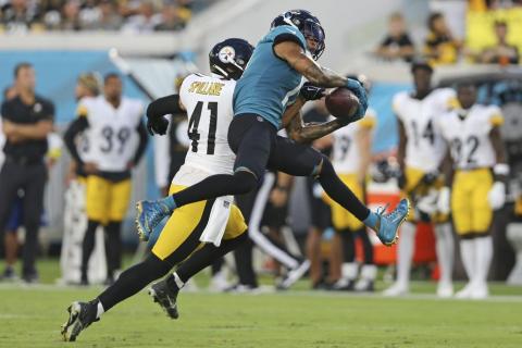 Jacksonville Jaguars wide receiver Marvin Jones Jr. (right) makes a reception in front of Pittsburgh Steelers linebacker Robert Spillane during Saturday’s preseason game in Jacksonville. (GARY MCCULLOUGH/Associated Press)