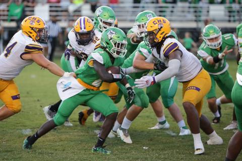 Columbia High defensive lineman Rashod Bradley closes in on Suwannee High running back Marquavious Owens during the Preseason Classic on Aug. 19. (BRENT KUYKENDALL/Lake City Reporter)