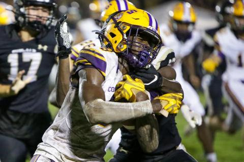 Columbia receiver Jaylen Cooper gets tackled on a kickoff return by a Buchholz defender on Thursday night. (BRENT KUYKENDALL/Lake City Reporter)