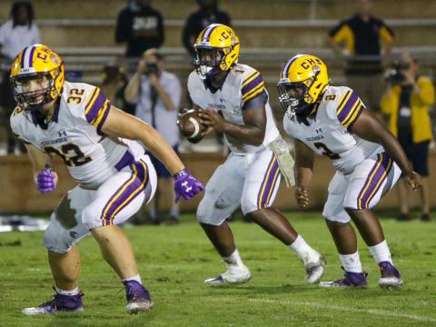 Columbia quarterback Tyler Jefferson (1) takes the snap alongside running back Tony Fulton (2) while fullback Colton Williams (32) heads up the field to block. (BRENT KUYKENDALL/Lake City Reporter)