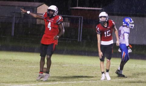 Fort White running back Maliki Clark signals a first down after a long run against Taylor County last Friday. (MORGAN MCMULLEN/Lake City Reporter)