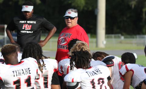 Fort White head coach Lee Dorsett addresses his team following a team scrimmage on Aug. 12. (MORGAN MCMULLEN/Lake City Reporter)