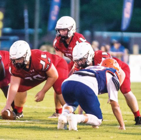 Fort White quarterback Clayton Philpot gets set to take a snap during last Friday’s Preseason Classic against Branford. (CHRISTINA FEAGIN/Special to the Reporter)