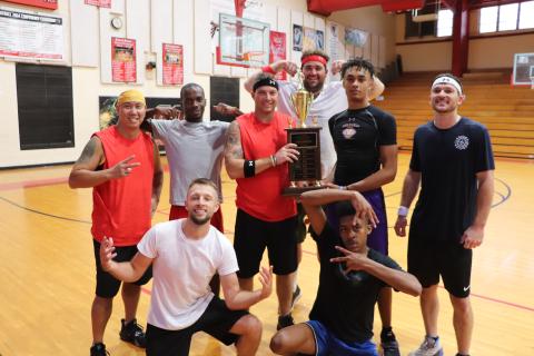 The Lake City Fire Department team poses with the newly won Boots and Badges Charity Basketball trophy. (COURTESY)