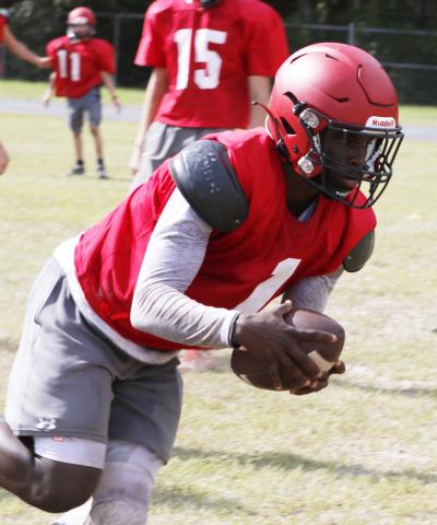 Lafayette’s Karlos Murphy scoops up a fumble during practice on Aug. 3. (JAMIE WACHTER/Lake City Reporter)