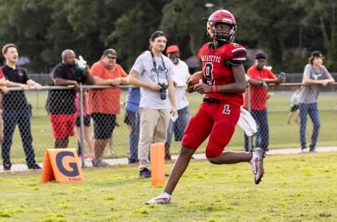 Lafayette quarterback Tywan Williamson scores a touchdown on keeper against Dixie County last Friday. (JACK HOWDESHELL/Special to the Reporter)