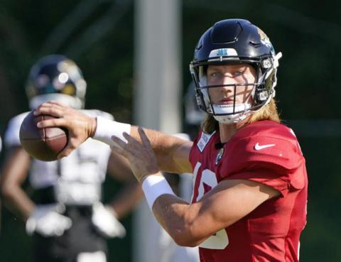 Jacksonville Jaguars quarterback Trevor Lawrence looks for a receiver during practice on July 31 in Jacksonville. (JOHN RAOUX/Associated Press)